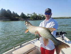 Single fisherman catching a large fish in Valentine
