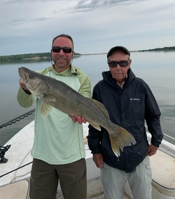 Successful angler with a large walleye fish caught in Valentine