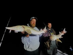 Two people fishing in MI