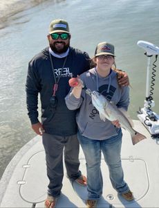 Proud Redfish Catch