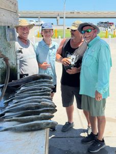 Two people fishing on a sunny day in TX