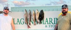 Two people fishing for five redfish in Rockport
