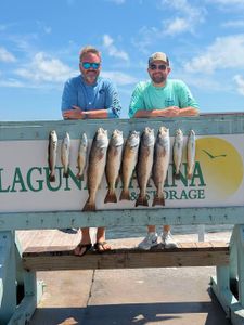 Successful redfish catch displayed on fishing cleaning station in Rockport TX