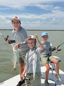 Successful speckled trout fishing trip on boat in Rockport TX waters