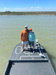 Fishing boat on calm waters in Rockport TX with trolling motor visible