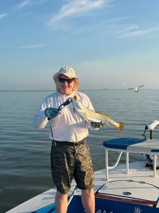 Successful fishing trip in Rockport TX showing caught fish on boat deck