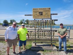 Three anglers cruising and fishing on the water in OH