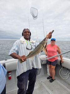 Two people enjoying cruises and fishing in Conneaut