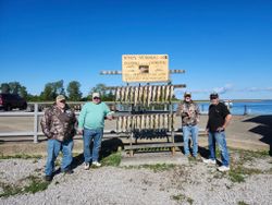 4 people standing in Ohio on cruises and fishing trip