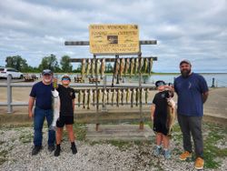 A group of four people fishing for rainbow trout in Conneaut