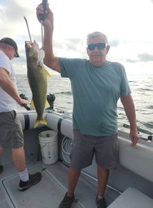 Two people enjoying a fishing cruise in OH