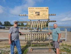 Two people enjoying a fishing cruise in Ohio