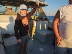 Two people enjoying a fishing cruise in Conneaut