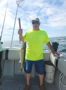 Angler fishing in Ohio with cruises and fishing equipment