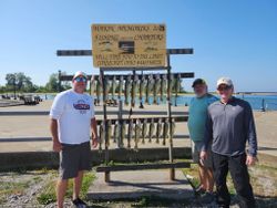 Three people enjoying a scenic cruises and fishing adventure in OH