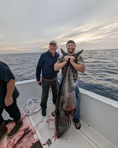 Brett and his dad with a 200lb tuna 100 miles out