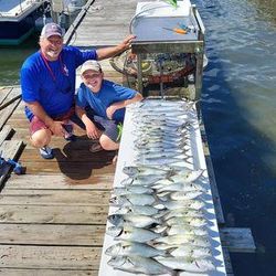 Couple enjoying fishing trip at Atlantic Beach