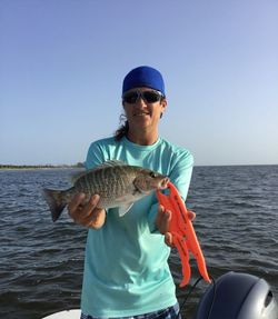 A person fishing in FL