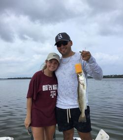 Fisherman with spotted weakfish, fishing in FL