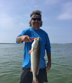 A lone angler fishing in the waters of FL