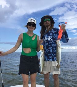 Two spotted weakfish being caught while fishing in Florida