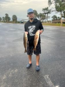 Angler holding 2 fish in TX