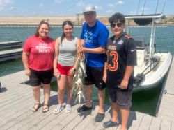 4 people fishing with big fish in TX