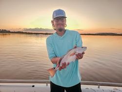 Angler with one 13-inch fish in Fritch