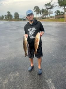 Two fish caught by a person in Fritch