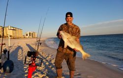 Angler catching a 21-inch fish in Pensacola, Florida