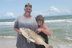 Two people fishing with a large catch in Florida