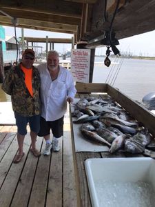 2 anglers with a 12-inch fish in LA