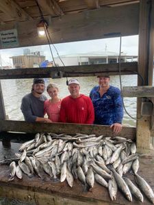 4 people enjoying a fishing and hunting trip in Golden Meadow