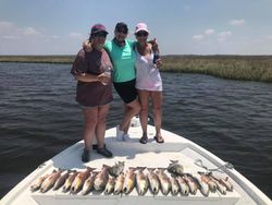 Three people enjoying a fishing and hunting trip in LA