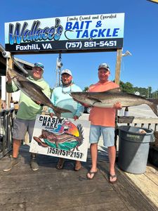 three people fishing with two fish in va