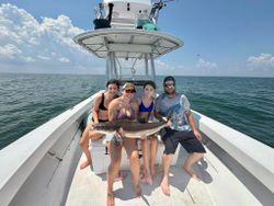 A group of 4 people fishing in Hampton