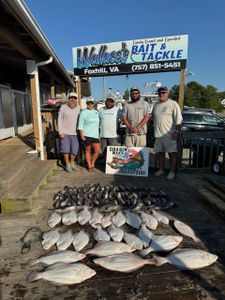 3 fish being caught in Virginia by 5 people enjoying a fishing trip
