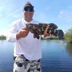 Angler holding a 17-inch fish in FL
