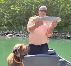 Angler with a large rainbow trout fish caught in Kentucky
