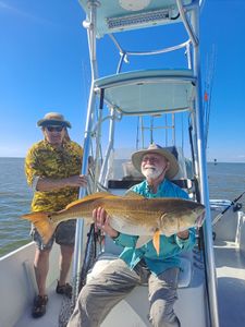 Two people fishing with one big fish in Texas