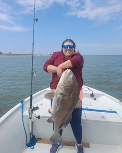Angler with a large black drum fish caught in Port O'Connor