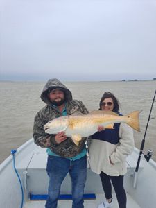 Two people fishing at Port O'Connor