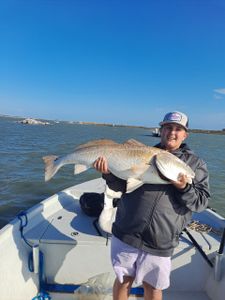 A person fishing in TX