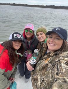 Four people enjoying a fishing trip in Port O'Connor