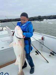 Angler with a fishing rod at Port O'Connor