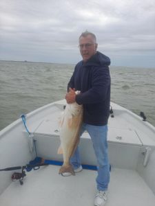 Angler holding a 21-inch fish in TX