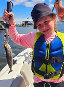 A person fishing in Orange Beach