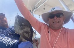 Two people fishing at the beach in Orange Beach