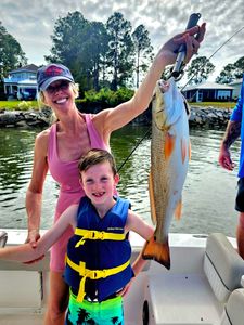 Successful redfish catch displayed on fishing boat in Orange Beach AL