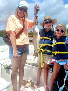 Successful redfish catch on fishing charter boat in Orange Beach Alabama
